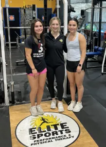 Emma and Liz Lehan, gymnasts with a teammate at Elite Sports Performance & Physical Therapy 