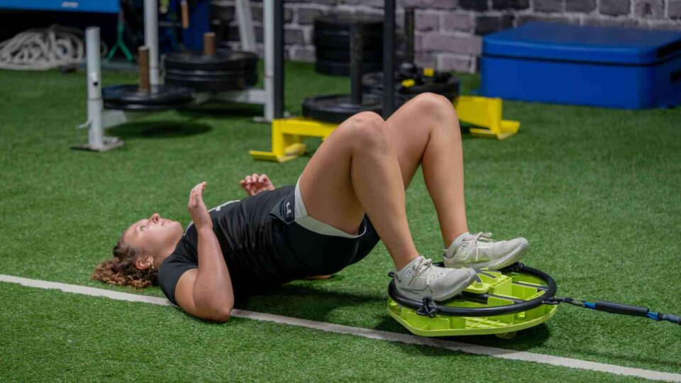 Glute bridge with resistance band at Elite Sports Performance & Physical Therapy