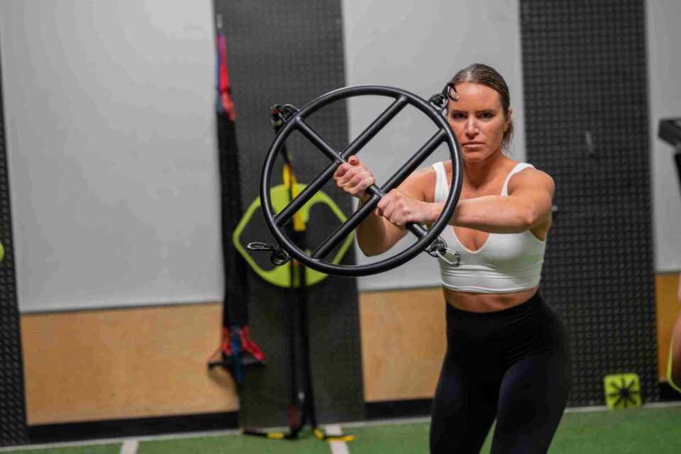 Woman training with resistance ring at Elite Sports Performance & Physical Therapy