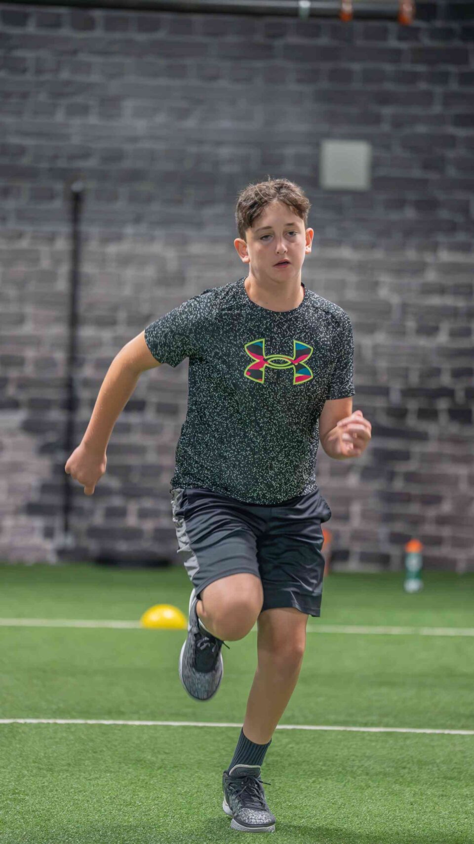 Young athlete sprinting indoor at Elite Sports Performance & Physical Therapy